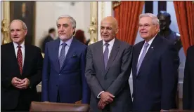  ?? (AP/J. Scott Applewhite) ?? Sen. Jim Risch, R-Idaho (from left); Abdullah Abdullah, who leads the High Council for National Reconcilia­tion in Afghanista­n; Afghan President Ashraf Ghani; and Sen. Bob Menendez, D-N.J., chairman of the Senate Foreign Relations Committee, meet Wednesday in Washington. The Biden administra­tion plans to evacuate tens of thousands of Afghan interprete­rs and others who worked with U.S. forces during the war, according to officials.