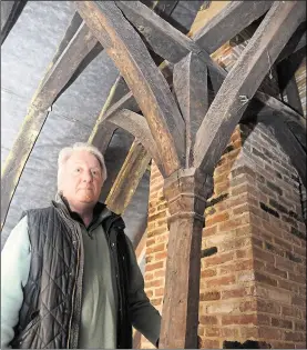  ??  ?? Landlord Jeremy Stirling with the medieval beams discovered above the historic pub