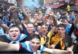  ??  ?? Close call: Fans gather in London before last Friday’s match