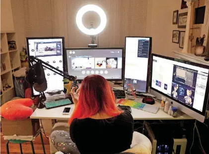  ?? [PHOTO BY TIMOTHY C. WRIGHT, FOR THE WASHINGTON POST] ?? Marsi sits at her desk where she engages with other video gamers on Twitch. To protect her real-world privacy, she goes by her online identity, kungfufrui­tcup.