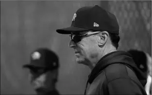  ?? DARRON CUMMINGS AP PHOTO/ ?? Oakland Athletics manager Bob Melvin watches as pitchers throw during spring training baseball, on Wednesday, in Mesa, Ariz.