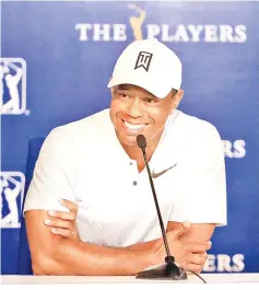  ?? — AFP photo ?? Tiger Woods speaks to the media during practice rounds prior to THE PLAYERS Championsh­ip at TPC Sawgrass in Ponte Vedra Beach, Florida.