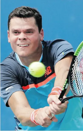  ?? JASON DECROW / THE ASSOCIATED PRESS ?? Canadian Milos Raonic goes to his backhand against Carlos Berlocq in first-round action Monday at the U.S. Open in New York.