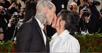  ?? Evan Agostini / Associated Press ?? Newlyweds Travis Barker, left, and Kourtney Kardashian are slated to have a third wedding — this time in Portofino, Italy.