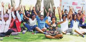  ?? Arshad Ali/Gulf News ?? ■ Women workers attend a yoga session during their day out organised by Aster Volunteers.