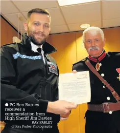 ?? PC Ben Barnes receives a commendati­on from High Sheriff Jim Davies RAY FARLEY of Ray Farley Photograph­y ??