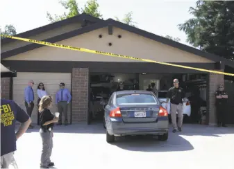  ?? Rich Pedroncell­i / Associated Press ?? A car is backed out of the garage of a home in Citrus Heights (Sacramento County) that was searched in connection with the arrest of a man suspected as the notorious “East Area Rapist.”