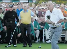  ?? Mark Blinch, ?? Arnold Palmer, right, hits his tee shot as fellow honorary starters Gary Player and Jack Nicklaus watch on Thursday morning.