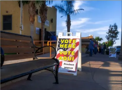  ?? PHOTO VINCENT OSUNA ?? A sign, which states “Vote here”, sits outside the Veterans Memorial Hall in Imperial on Tuesday during Election Day.