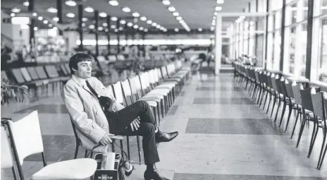  ??  ?? Jimmy Nicol, stand-in drummer for the Beatles’ Ringo Starr, waits for his plane at Essendon Airport.