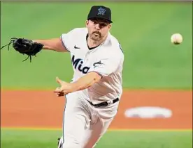  ?? Eric Espada / Getty Images ?? Jake Fishman of the Miami Marlins threw 31⁄3 innings against the Mets in his MLB debut, allowing one run before returning to the minors.