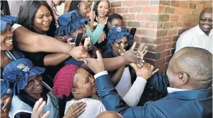  ?? / ELMOND JIYAN/ GCIS ?? President Cyril Ramaphosa greeting staff members and workers at Siqongweni High School in Imbali township, Pietermari­tzburg, yesterday.