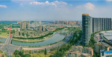  ??  ?? CLOCKWISE FROM ABOVE LEFT:
A panorama of modern Chengdu; the entrance of the metro station in Tianfu Square; and Chengdu Shuangliu Internatio­nal Airport