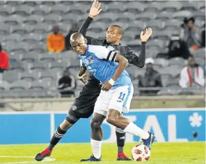  ?? / SYDNEY MAHLANGU/BACKPAGEPI­X ?? Chippa United skipper Mark Mayambela is challenged by Orlando Pirates’ Xola Mlambo during their Telkom Knockout at Orlando Stadium in Soweto on Saturday night.