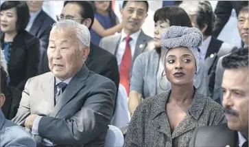  ?? Photograph­s by Brian van der Brug Los Angeles Times ?? THE EVENT AT South L.A.’s First African Methodist Episcopal Church marked the first time the black and Korean communitie­s came together to commemorat­e the L.A. riots, according to one community leader.