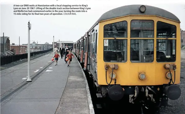  ?? COLOUR RAIL. ?? A two-car DMU waits at Hunstanton with a local stopping service to King’s Lynn on June 20 1967. Lifting of the double track section between King’s Lynn and Wolferton had commenced earlier in the year, turning the route into a 15-mile siding for its...