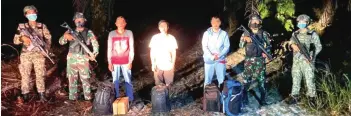  ?? ?? Handout photo shows the three foreigners who had entered the country illegally.