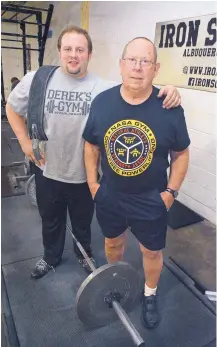  ?? JIM THOMPSON/JOURNAL ?? Derek Whitlow, left, and his father, Jerry, set U.S. powerlifti­ng records in December.