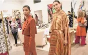  ?? ?? Tyrah Burton, left, and Maggie Skinner model clothing from the Fall 2024 line at the post-Fashion Week party at the Christian Siriano boutique on Thursday, March 14.