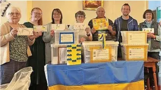  ?? ?? ●●St Edmund’s Church in Falinge has already collected 250 shoeboxes-worth of donations and plans to double the number to ensure children in Ukraine have something special to open at Christmas. Below: Howard Bowden and Michael Buczman (left)
