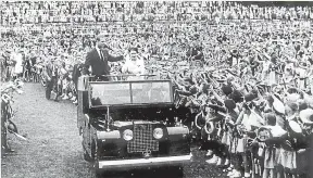  ?? ?? An estimated 18,000 people flocked to New Plymouth’s Pukekura Park to see the Queen and the Duke of Edinburgh on their first visit to the city in 1954