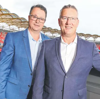  ?? Picture: TIM MARSDEN ?? Metricon Queensland boss Jason Biasin and Gold Coast Suns CEO Mark Evans at Metricon Stadium, Carrara. The building firm has worked with the AFL club since 2011.