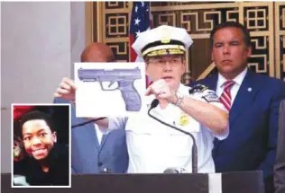  ??  ?? COLUMBUS, Ohio: Columbus Police Chief Kim Jacobs holds up a photo showing the type of BB gun that police say a 13-year-old boy named Tyre King (inset) pulled from his waistband just before he was shot and killed by police investigat­ing an armed robbery...