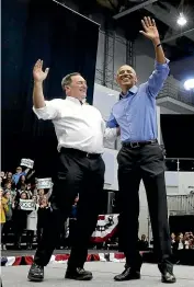  ?? AP AP ?? Former president Barack Obama, right, and Democrat candidate Senator Joe Donnelly wave to the crowd. Barack Obama greets Democrat supporters at the rally in Gary, Indiana, in the run up to the midterm elections in the United States.