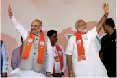  ?? — PTI ?? Prime Minister Narendra Modi with BJP president Amit Shah at the “Gujarat Gaurav Mahasammel­an” in Ahmedabad on Monday.