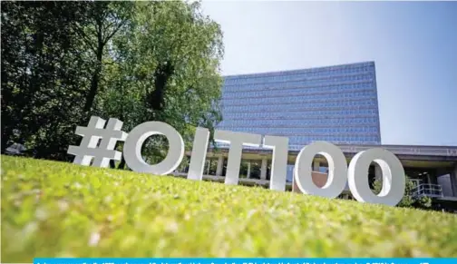  ?? — AFP ?? A sign commemorat­ing the 100th anniversar­y of the Internatio­nal Labour Organizati­on (ILO) is pictured in front of its headquarte­rs on June 7, 2019 in Geneva.