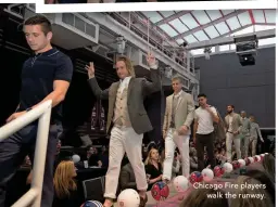  ??  ?? Chicago Fire players walk the runway.