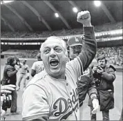  ?? AP FILE ?? Los Angeles Dodgers manager Tom Lasorda celebrates after beating the Montreal Expos for the National League title in Montreal in this Oct. 19, 1981, file photo.