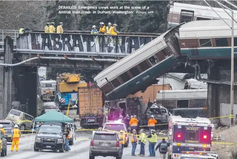  ?? Picture: AFP ?? DERAILED: Emergency crews work at the scene of a Amtrak train crash in DuPont, Washington.