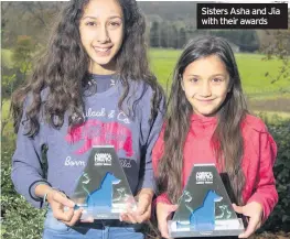  ??  ?? Sisters Asha and Jia with their awards