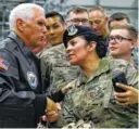  ?? AP PHOTO/JACQUELYN MARTIN ?? Vice President Mike Pence greets U.S. troops after speaking Friday at Ramstein Air Force Base in Germany.