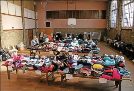  ?? LEAH MCDONALD - ONEIDA DAILY DISPATCH ?? Volunteers sort through winter gear donations at the First United Methodist Church at 116W. Grove St. on Wednesday, Nov. 8, 2017. The giveaway will be held on Saturday, Nov. 11, 2017, from 9a.m. to noon at the church.