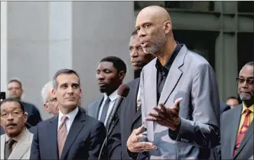  ?? KAREEM ABDUL-JABBAR Luis Sinco Los Angeles Times ?? embraces the philosophi­es of Rev. Martin Luther King Jr. and Malcolm X.