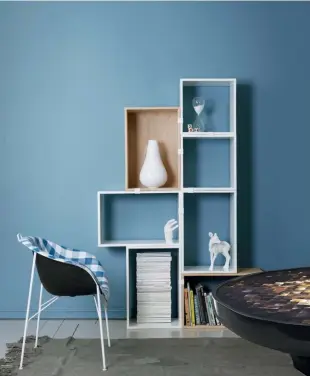  ??  ?? LEFT TO RIGHT A wall clad in the youthful Retro blue by Jotun; Akar de Nissim’s Iris coffee table is made with marble and buffalo horn marquetry, and paired with either a Tahiti shell or lacquer finish; Loaf’s velvet curved sofa range comes in lively...