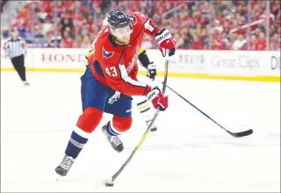  ?? AP PHOTO ?? Washington Capitals right wing Tom Wilson winds up for a shot April 29 during the second period in Game 2 of an NHL playoff series against the Pittsburgh Penguins in Washington. Washington signed the homegrown Wilson to a US$31.02-million, six-year...