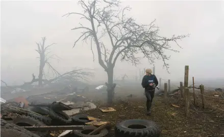  ?? SUNDANCE INSTITUTE ?? Photograph­er Evgeniy Maloletka appears in “20 Days in Mariupol,” a documentar­y narrated by video journalist Mstyslav Chernov.