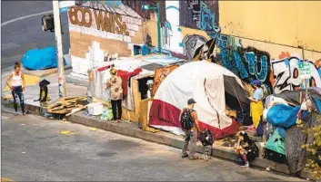  ?? Allen J. Schaben Los Angeles Times ?? A HOMELESS encampment on Los Angeles’ skid row in September 2021. L.A. County officials say the state of emergency would speed up the provision of services to the tens of thousands of people sleeping on the streets.