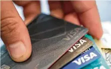  ?? Jenny Kane / Associated Press ?? When used responsibl­y, credit cards are a way to build credit history, but they’re not for everyone. Check the terms.