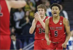  ?? ROBERT FRANKLIN — THE ASSOCIATED PRESS FILE ?? Ball State’s Ishmael El-Amin (5) and Sean Sellers (34) celebrate during the second half of an 80-77 win over Notre Dame in South Bend, Ind.