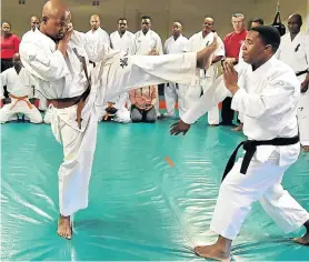  ?? Picture: EUGENE COETZEE ?? LONG LEG OF THE LAW: Constable Bulelani Manyakama, left, and sensei Constable Lonwabo Ndzima, of the SAPS Eastern Cape martial arts team, trade blows during a training session at MJ’s Dojo in preparatio­n for the SAPS Full Contact Karate Tournament