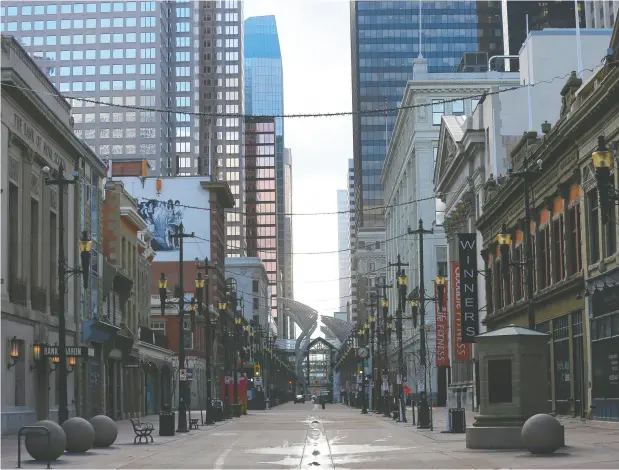  ?? Da rren Makowich uk/ Postmedia ?? Downtown Calgary was eerily empty on April 15 during the COVID-19 lockdown, a scene playing out in big cities worldwide.