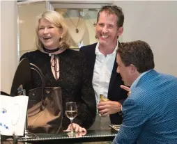  ??  ?? Martha Stewart, left, and a friend browse the booth of David Rovinsky Fine Jewelry. Photo by Andrea Hansen.