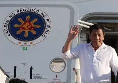  ??  ?? Philippine President Rodrigo Duterte waves upon his arrival at the airport in the capital Amman on September 5. — AFP photo