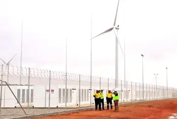  ??  ?? Tesla’s Powerpacks are connected to a wind farm in Hornsdale, owned by French renewable energy company Neoen. It is the world’s largest lithium-ion battery capable of storing 100MWh. — Tesla photo