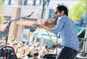  ??  ?? VIOLINIST-SINGER Kishi Bashi plays at Make Music Pasadena in 2015. The festival is now on hiatus.