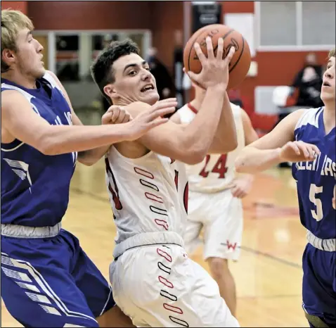  ?? Photo by John Zwez ?? Braeden Goulet of Wapakoneta, center, works his way through the Allen East defense during Tuesday’s game. See more photos at wapakdaily­news. com.